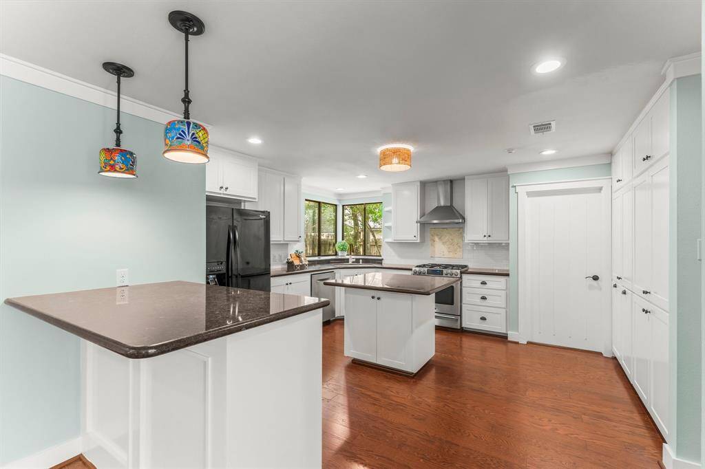 Kitchen offers an island and a breakfast bar,
