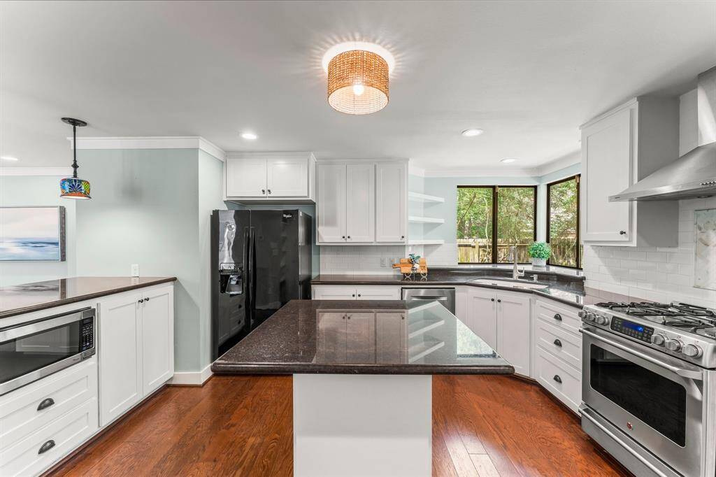 Enjoy the back yard views of nature from the kitchen windows.