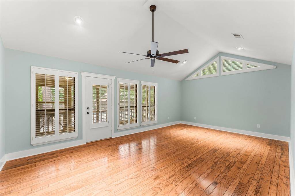 The primary suite is tucked behind the dining area and has a door directly to the screened in patio.