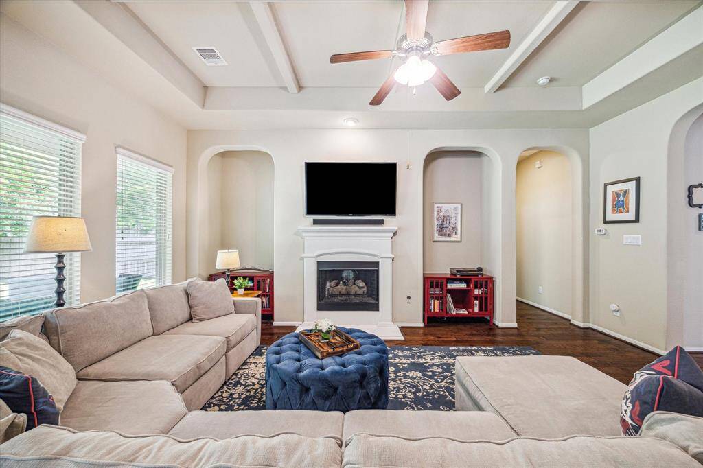 This spacious family room features a romantic gas-log fireplace and plenty of room for large comfortable furnishings. What a great spot to cozy up by the fire and unwind. Breathe, you are home now.