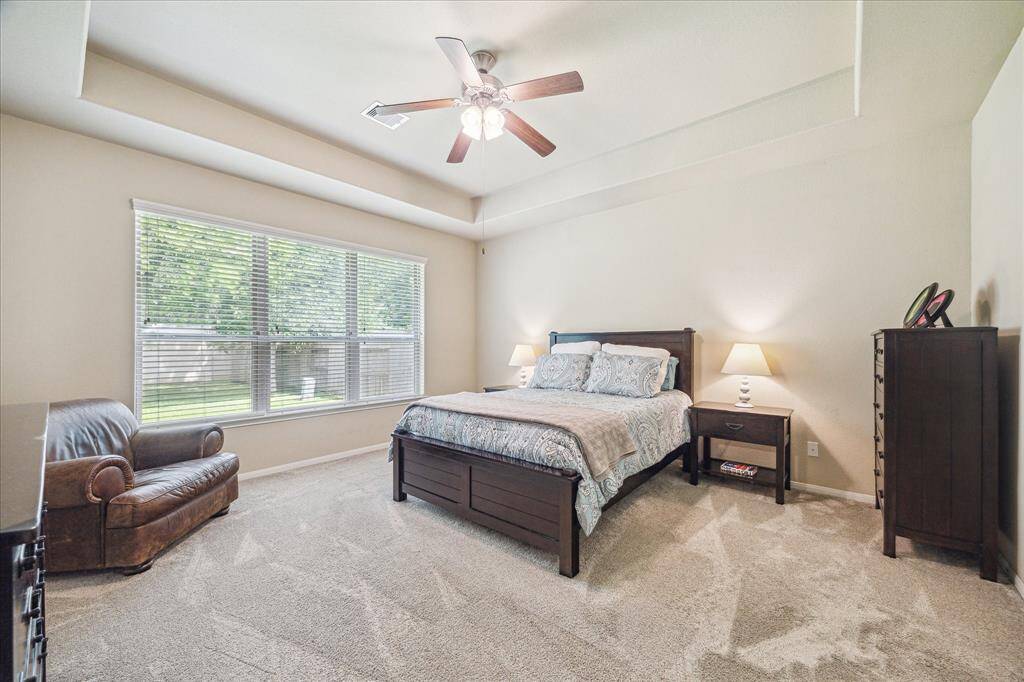 The owner’s retreat offers recent carpet, neutral paint, a raised tray ceiling with a cooling fan, a large walk-in closet, and a beautiful ensuite bathroom. This room has its own thermostat and zoned A/C for guaranteed comfort all night long.