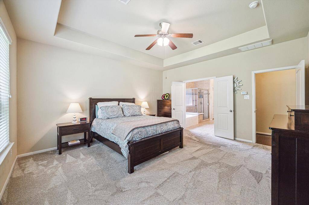Complete with a large walk-in closet and a spa-like ensuite bathroom, this private retreat is bathed in natural light and wrapped in warm, inviting finishes offering the perfect place to relax and recharge.