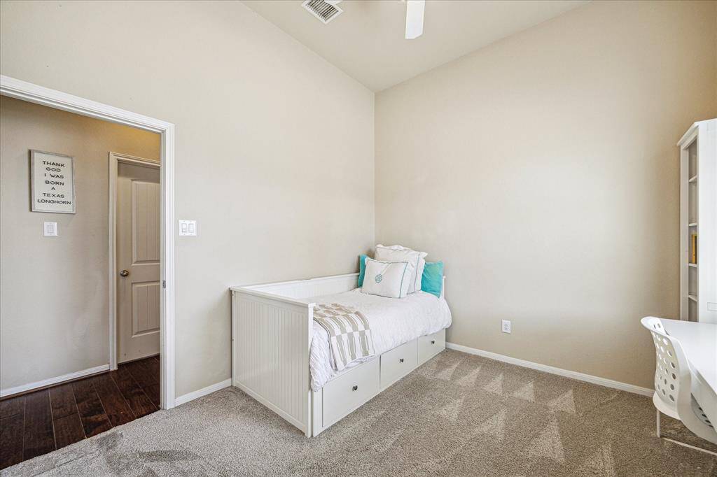 An alternate view reveals just how cozy and welcoming this guest room really is with soft neutral finishes, a spacious layout, and easy comfort that’ll make anyone feel right at home.