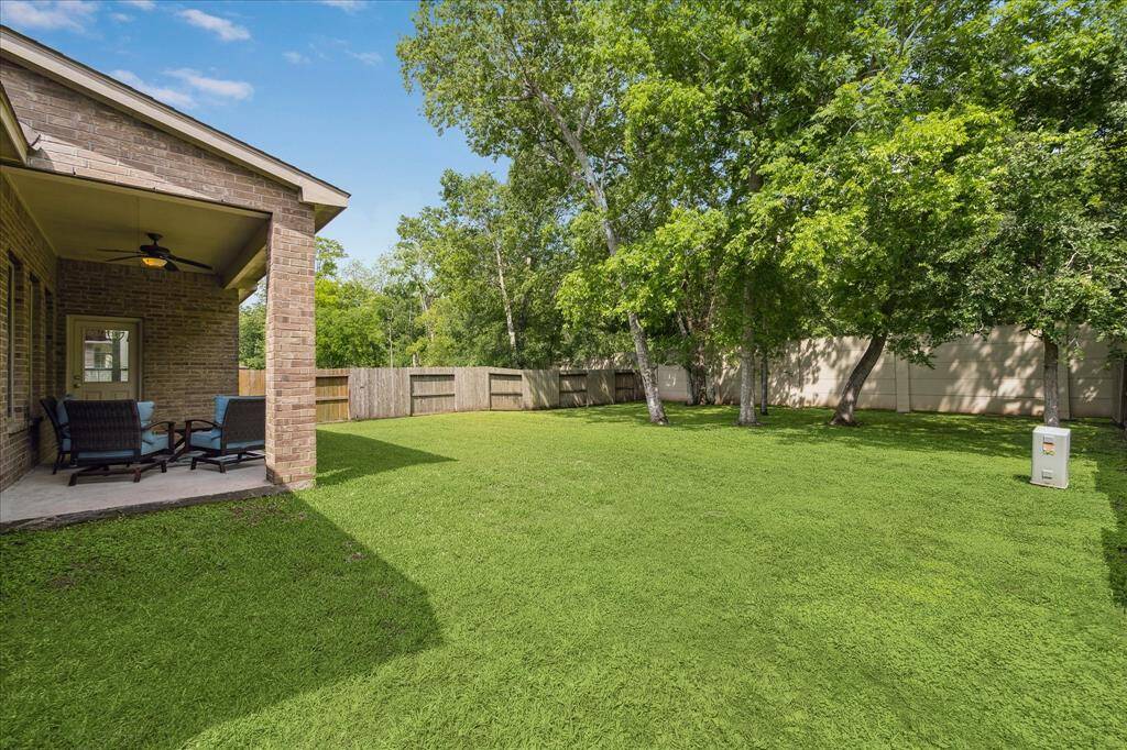 Relax outdoors in a spacious backyard offering privacy and peaceful views. With a full sprinkler system and plenty of room to roam, it’s the perfect setting for weekend gatherings or everyday enjoyment.