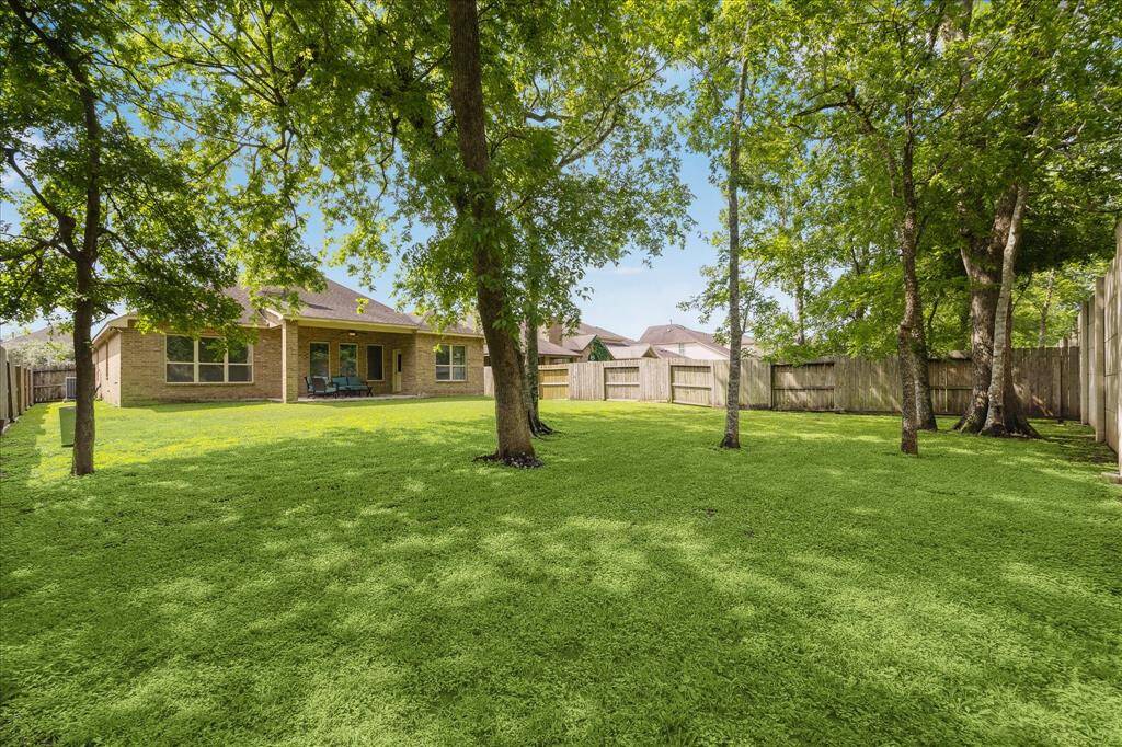 Shaded by scattered towering trees, this fully fenced backyard feels like a private retreat. With a full sprinkler system and plenty of room to roam, it’s a warm, welcoming space full of potential perfect for quiet mornings or playful afternoons.