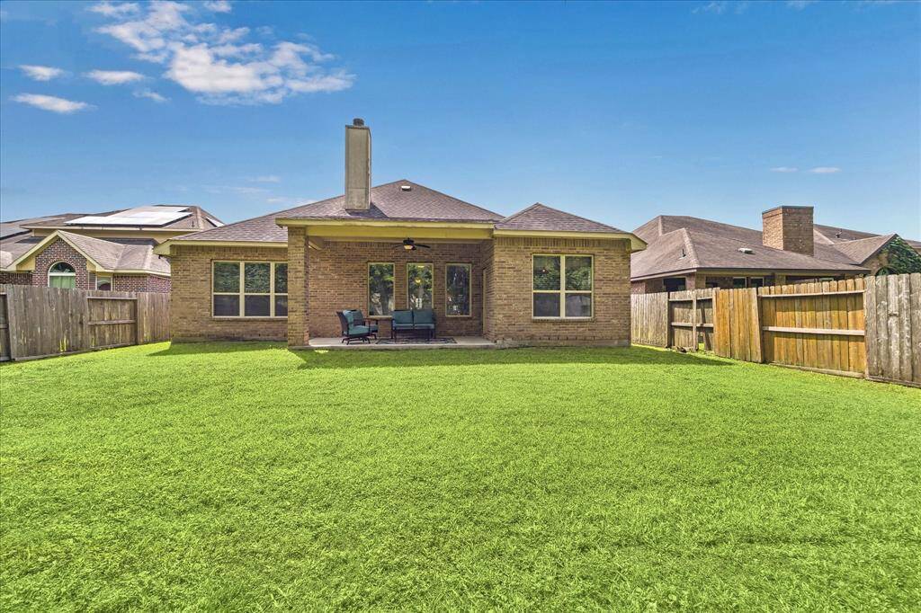 Whether you're hosting lively gatherings or seeking tranquility after a long day, this back yard paradise with a covered patio promises to provide the perfect space where memories are made and stress melts away.