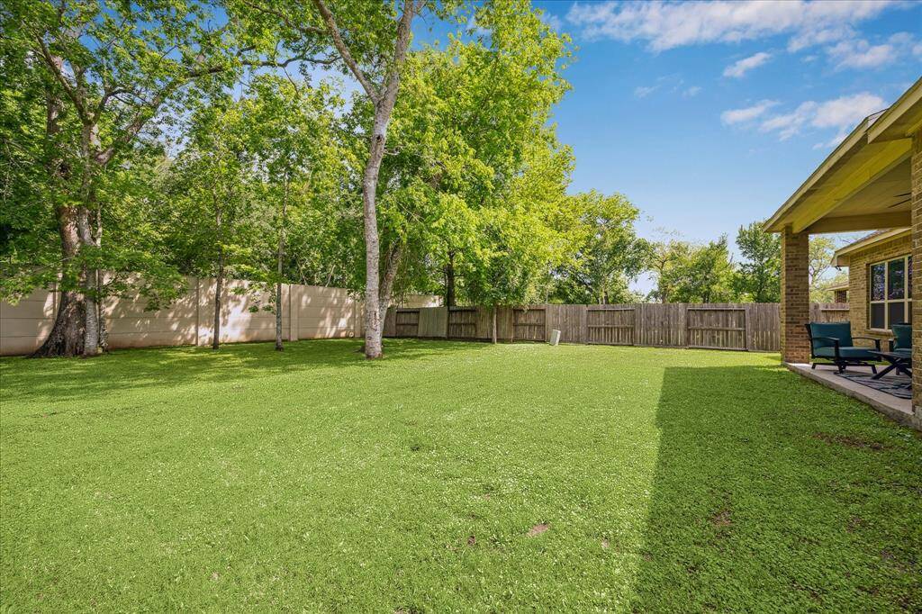 This inviting outdoor space has it all, scattered shade trees, a fully fenced yard with a full sprinkler system and a covered patio ideal for relaxing or entertaining. With plenty of room to roam, it’s the ideal canvas for a garden, play area, or your dream backyard retreat.