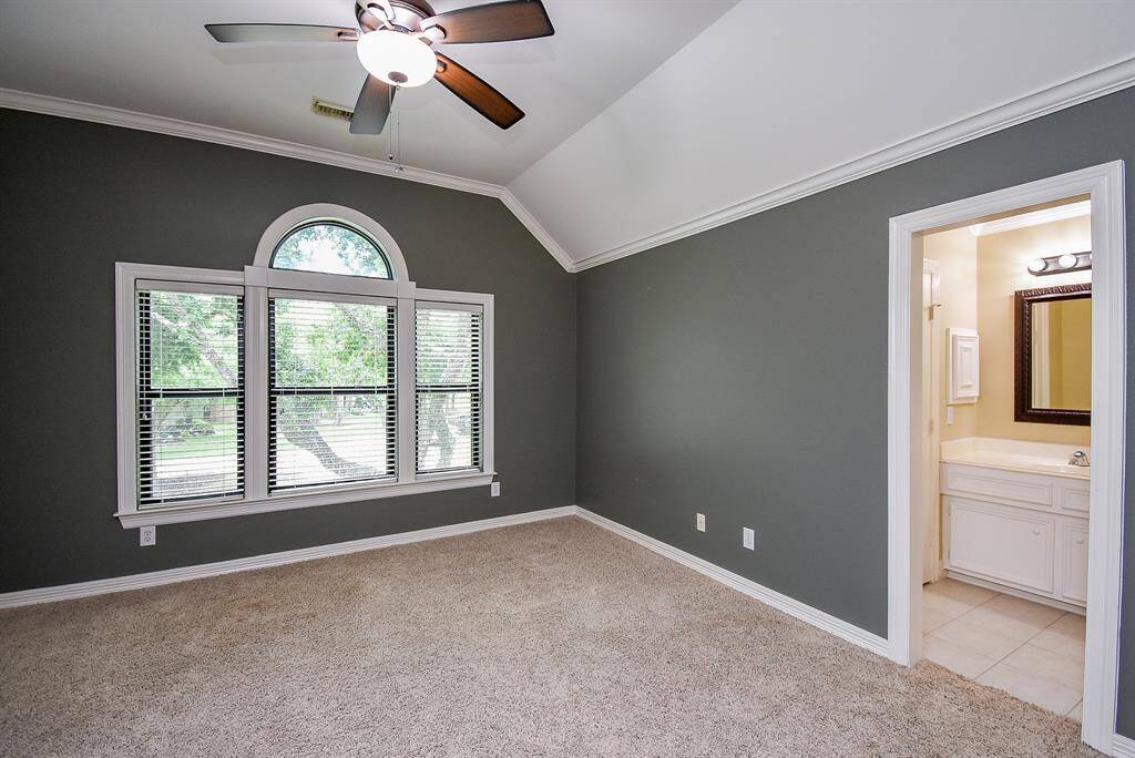 Bedroom 3 has a great view of the mature oak tree in the front yard overlooking the cul-de-sac! This bedroom has plenty of natural light, a large walk-in closet and cove ceiling.