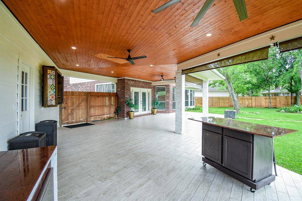 Custom built rolling island with cabinet storage space and matching granite for outdoor kitchen!