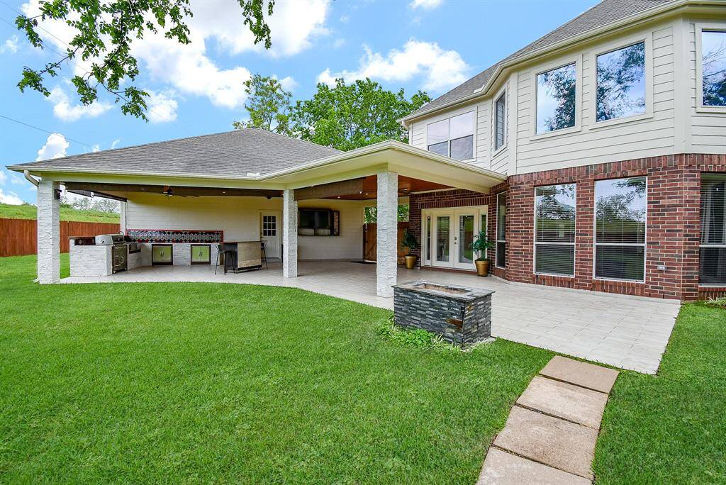 Outdoor firepit along the patio with dark gray stacked rock! Replaced entire roof over home with included a solar powered attic fan. Replaced fence on both sides of house and on each side with our neighbors.