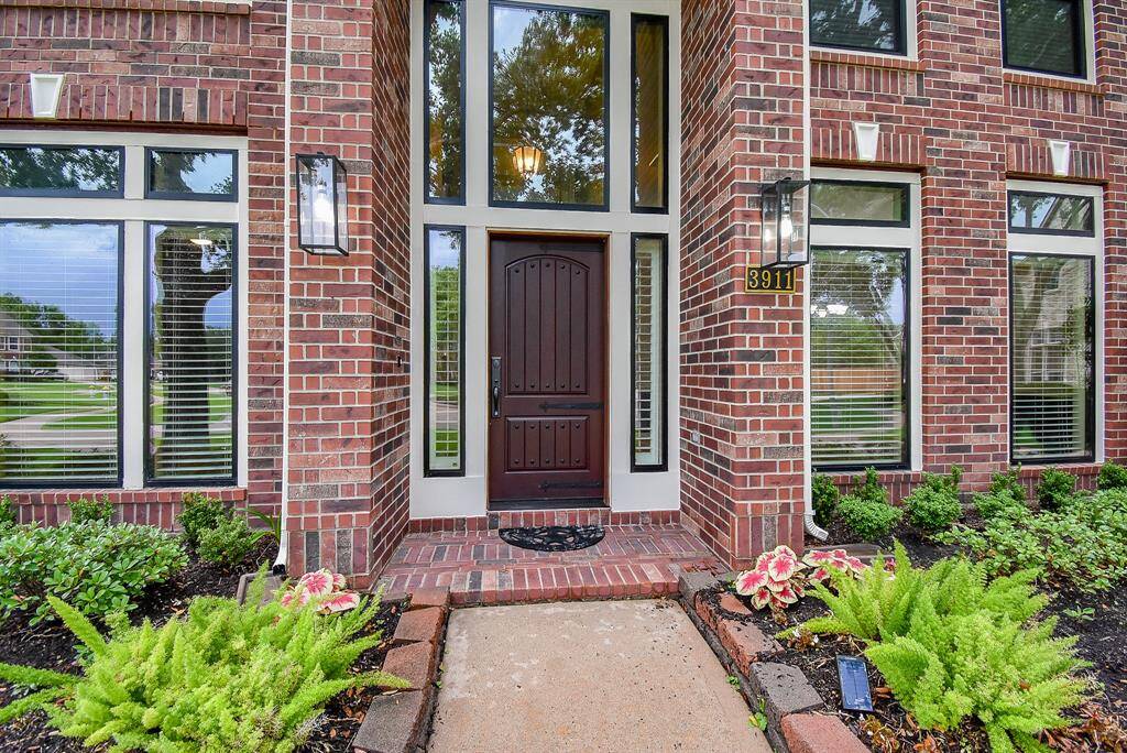 Replaced entry door to rid the builder grade standard door. The front door is a durable fiberglass that will not fade and deteriorate over time like wood. Brick covered front porch! Sprinkler system to keep both front and backyard thriving!