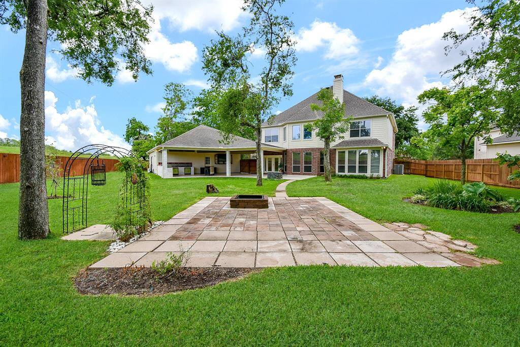A Paver walkway leads to comfortable gathering area for friends and family. Set up your favorite outdoor furniture surrounding and outdoor fire pit incased with natural stone. If you love bird watching, the sellers boast that you'll love living here!