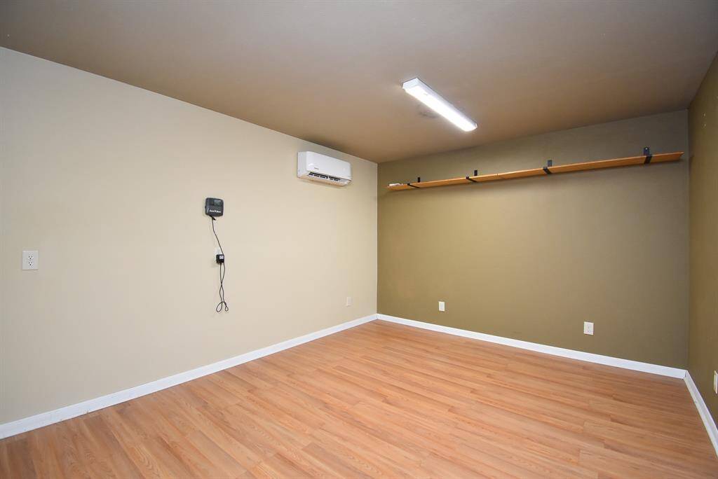 Studio/music room/office/work-out room built in garage with adjoining laundry room with pocket door separation.  Panasonic mini split AC unit for both heat and air conditioning. FLEX SPACE to use as you please!
