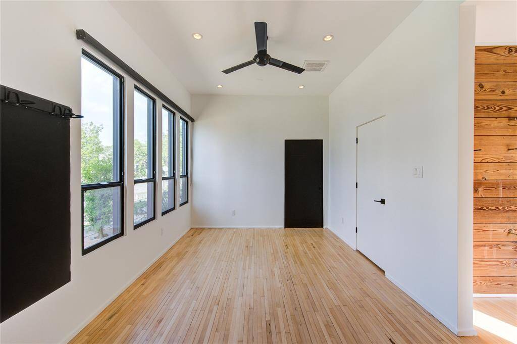 This versatile room, originally a dining area, easily transforms into a bedroom, gym, office, or game room to suit your needs.