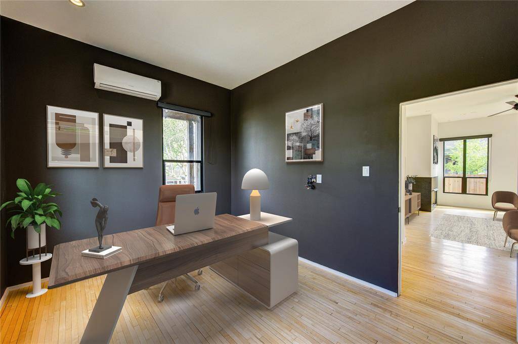 Elegant home office seamlessly connected to the bright living room.