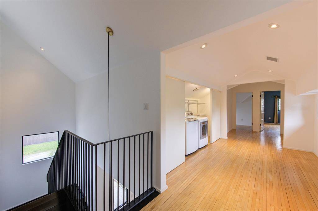 The upstairs landing features a versatile flex space, perfect for a study area, complete with and easy access to washer and dryer.