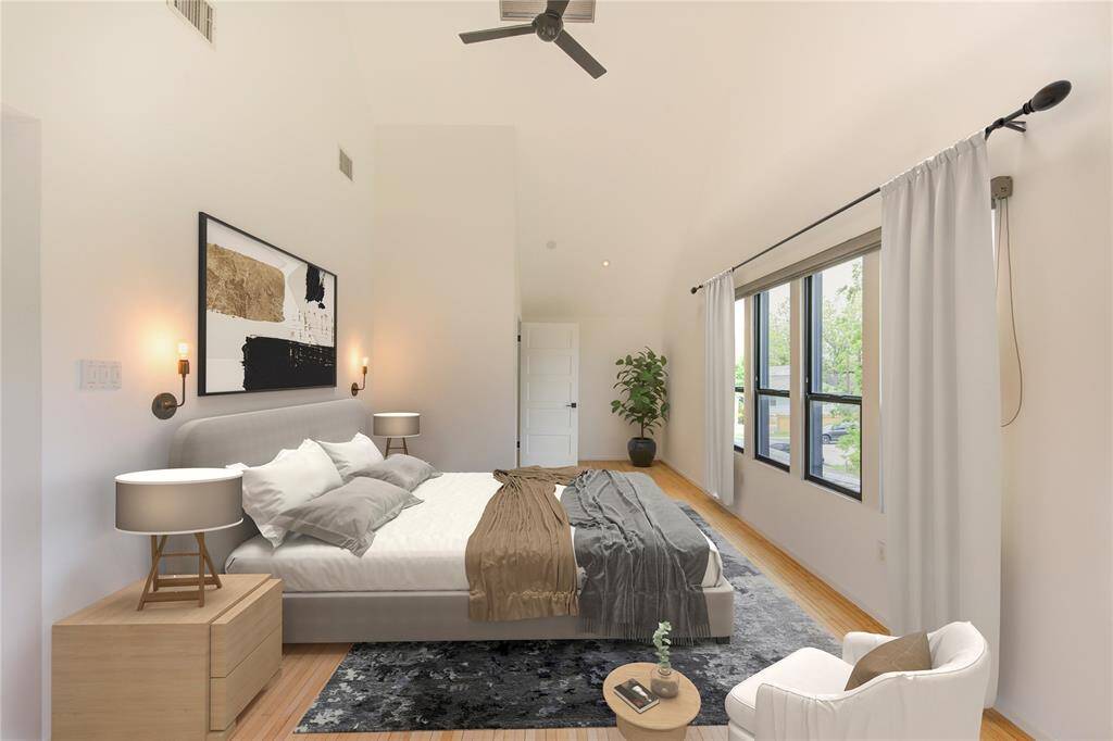 Experience privacy in this split floor plan, where the spacious primary bedroom comfortably fits a king-size bed and seating area. Virtually staged for inspiration.