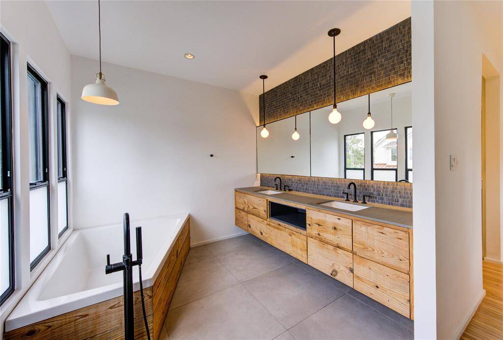 Luxurious bathroom featuring a spacious double vanity and an inviting soaking tub.