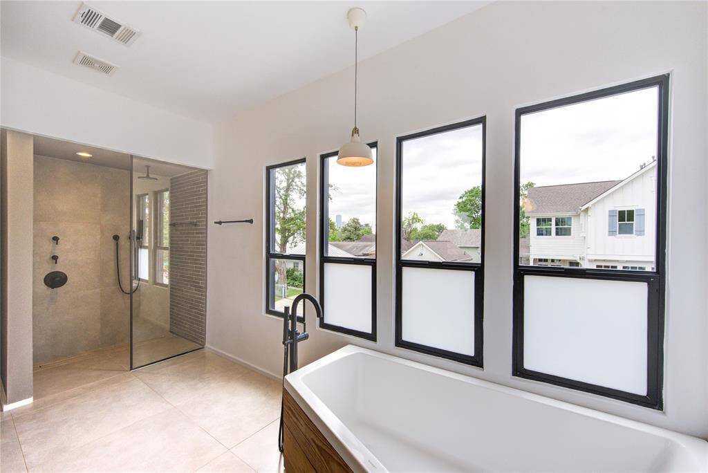 Open concept and minimalist shower ceiling mounted rainfall.