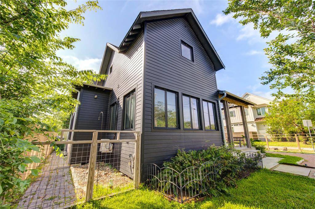 Newly installed side privacy fence and gravel drainage system ensure optimal water flow away from the home. Energy-efficient rainscreen siding enhances comfort and savings.