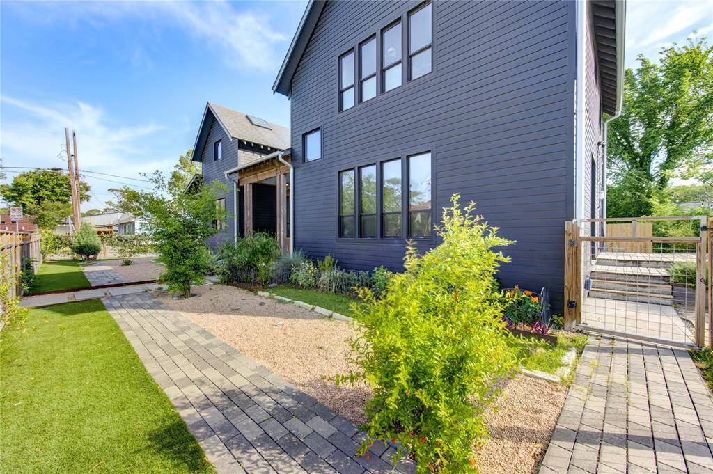 Professionally xeriscaped yard with native plants ensures minimal water use and optimal drainage year-round.