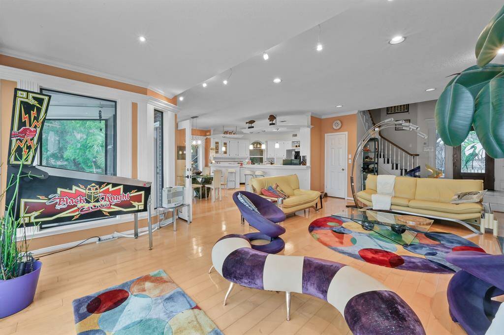 Large living area off the kitchen with wood flooring