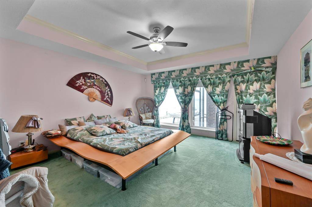 Primary bedroom with waterfront views