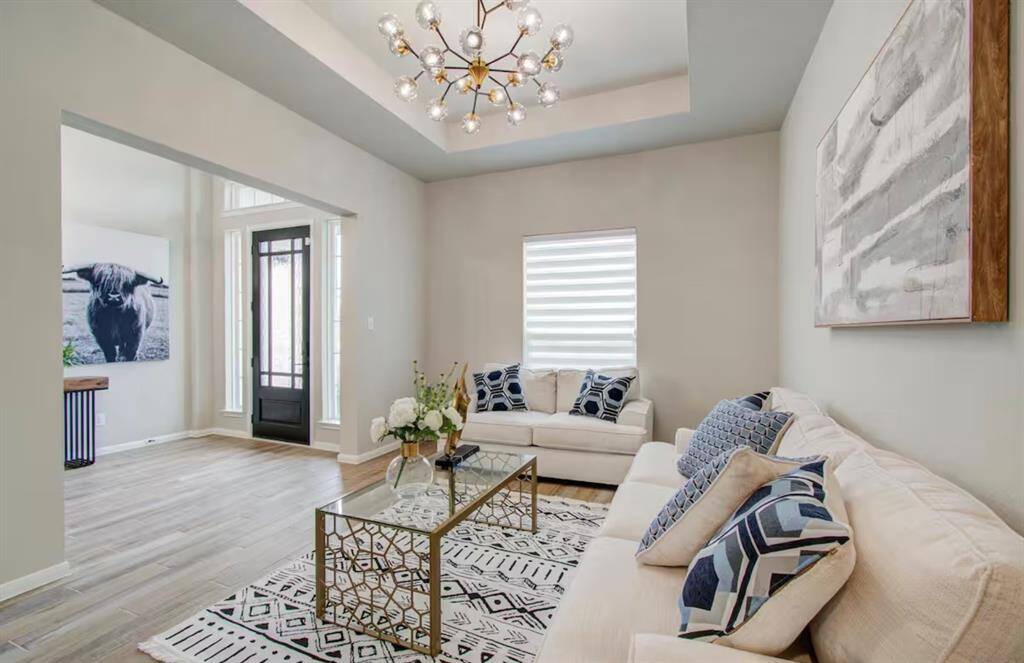 Step into luxury and warmth as youenter this home, where a welcoming den invites you into the home.