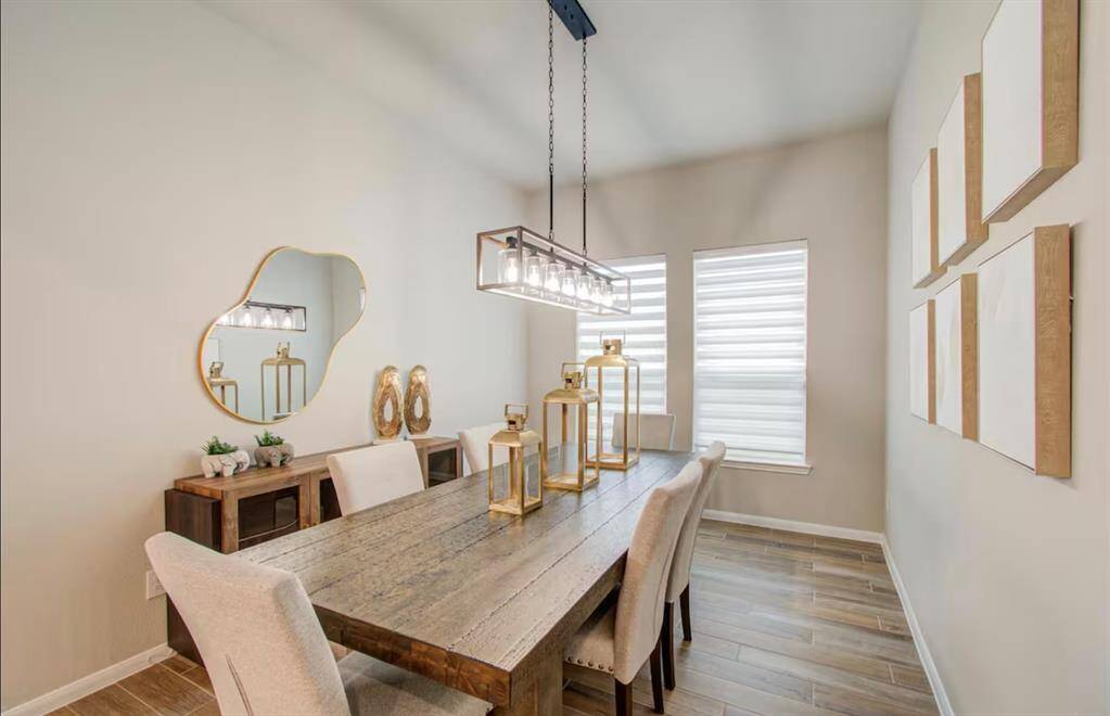 This dining room is bathed in naturallight streaming through large windows.
