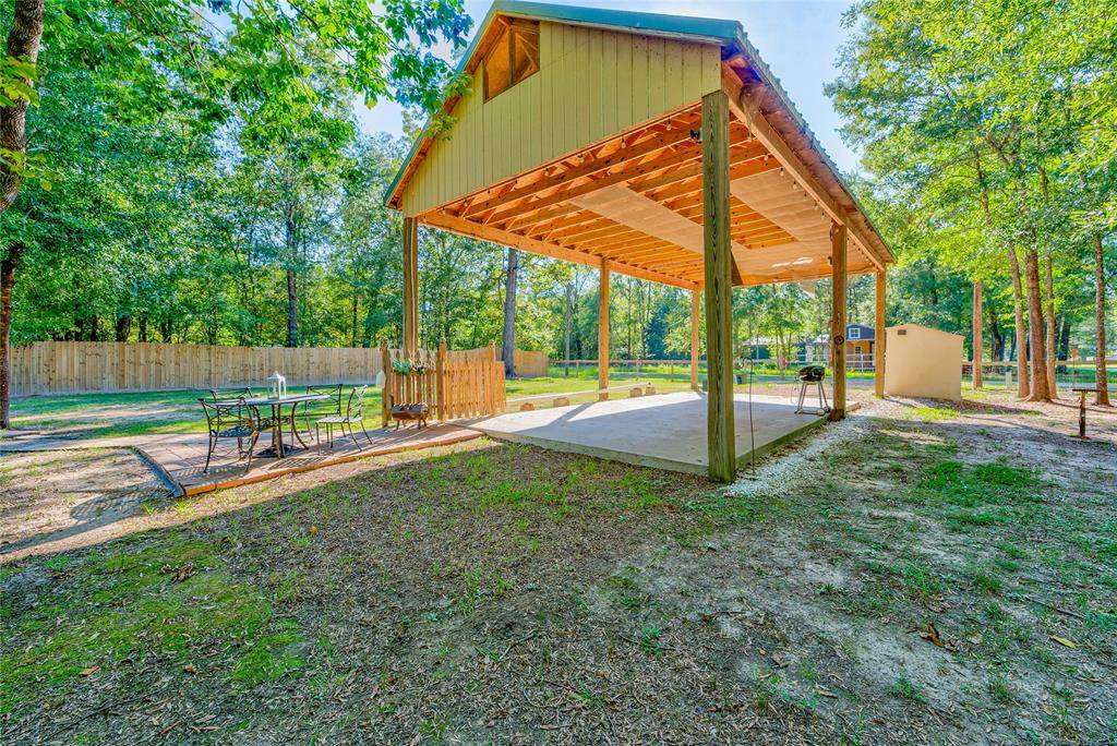 RV CARPORT WITH HOOK UPS, SPRINKLER IN PART OF PROPERTY