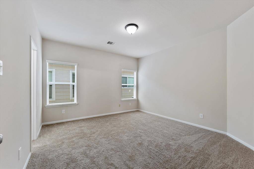 Primary bedroom, strategically located away from the secondary bedrooms.  2 windows with BLINDS!