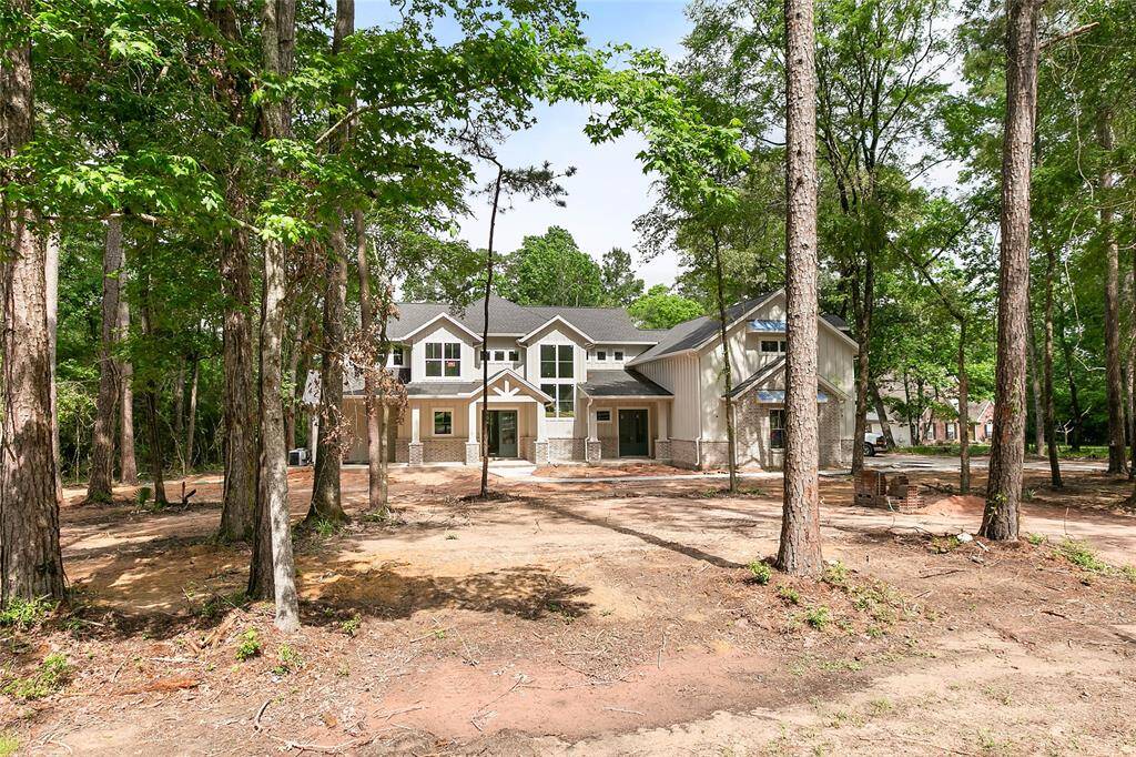 Absolutely beautiful over the top custom farmhouse style home in Magnolia!