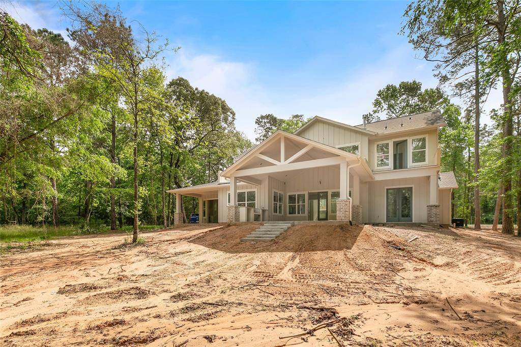 Lovely home is elevated on the lot and has gorgeous wooded views.