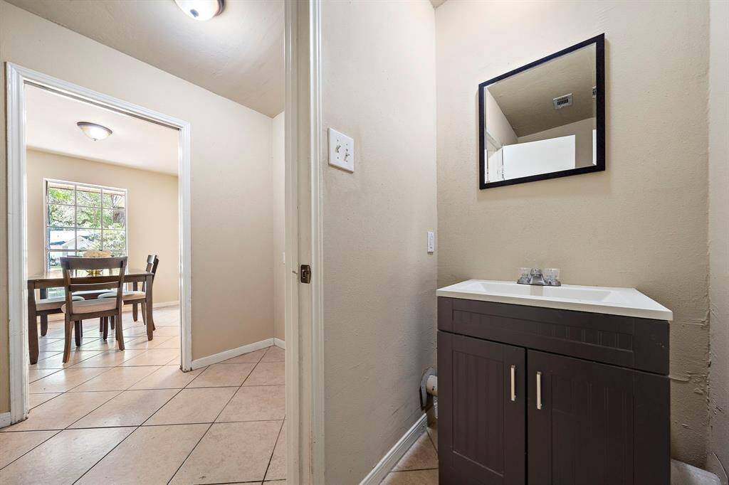 Half bath privately located off the utility room.
