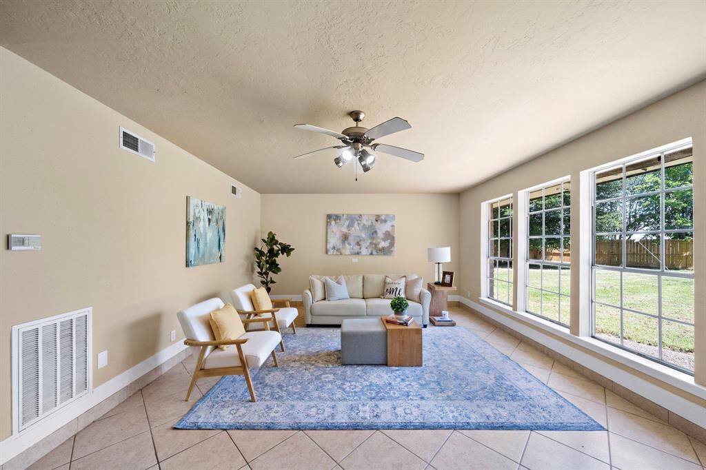 This room is large enough for any size couch/sectional and additional seating.