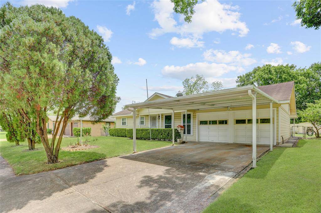 Front Elevation - Double-wide Drive, Carport and Two-Car Garage