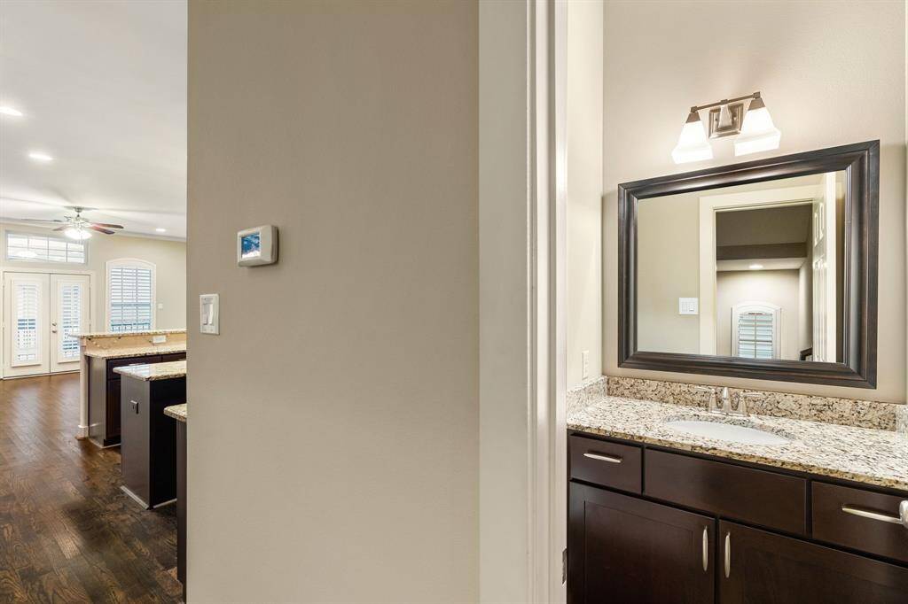 Half bathroom perfectly tucked away from the kitchen and living area.