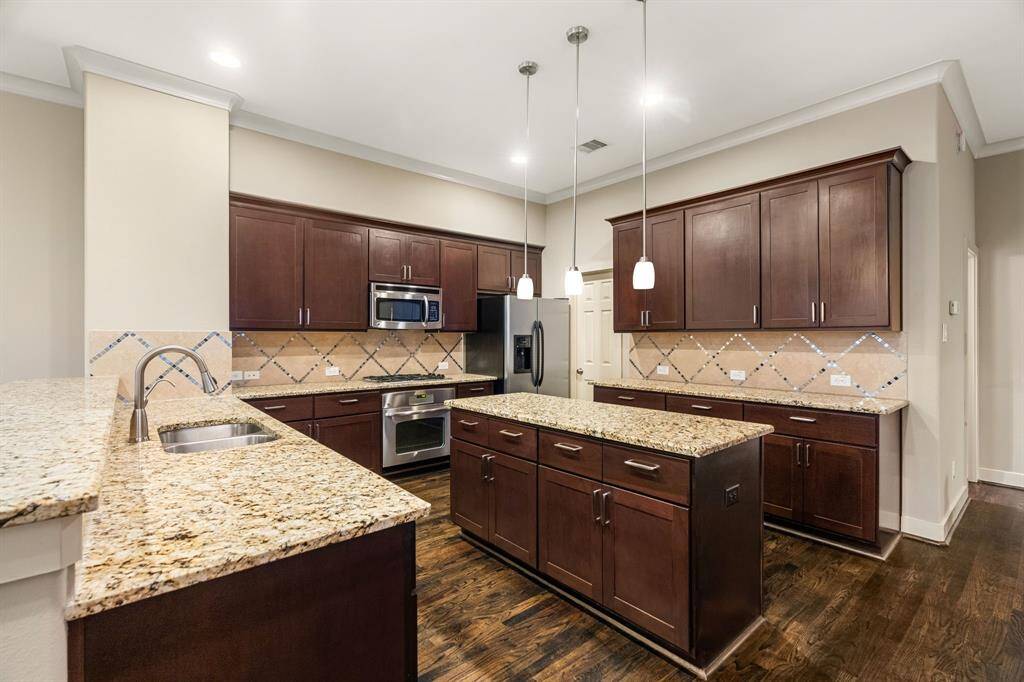 Can't get enough of this kitchen with gas grills and refrigerator is included