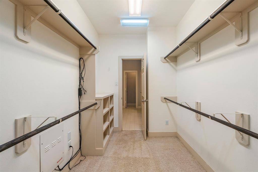 Walk-in primary closet.