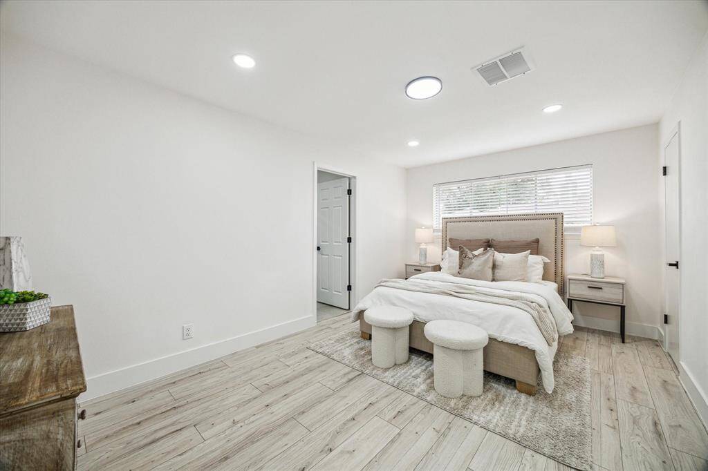 Your private retreat features a spacious walk-in closet and an en-suite bath, blending comfort and style