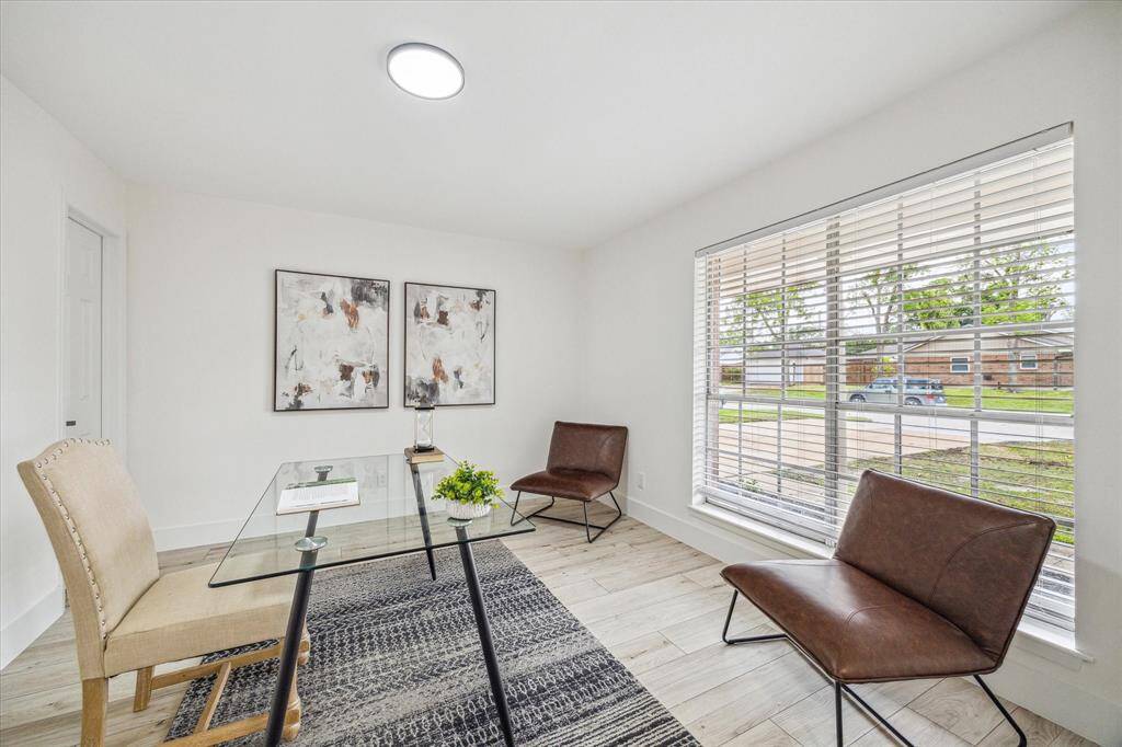 With large windows, French doors, and a closet, this versatile space can serve as a bright home office or easily convert into a fifth bedroom