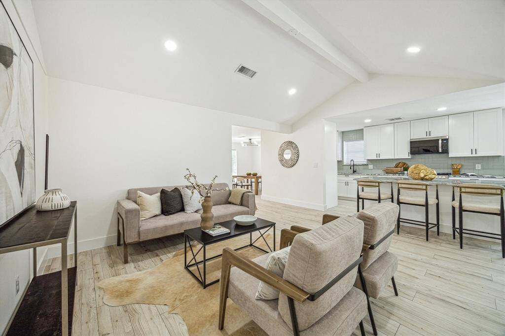 The open flow into the kitchen is ideal for gatherings and day-to-day comfort