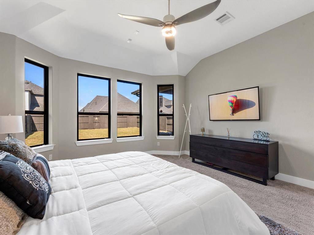 This stunning modern master bedroom is waiting for you