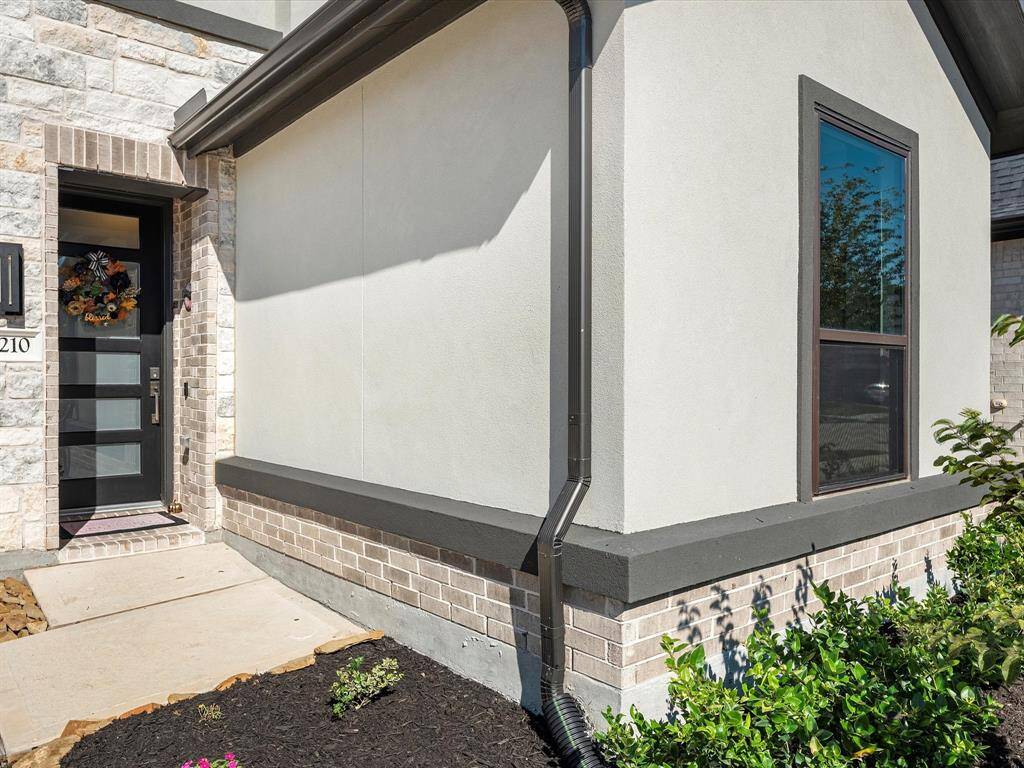 CHLOE RIDGE a modern masterpiece that effortlessly the timeless elegance of Brick with the sophistication of stucco