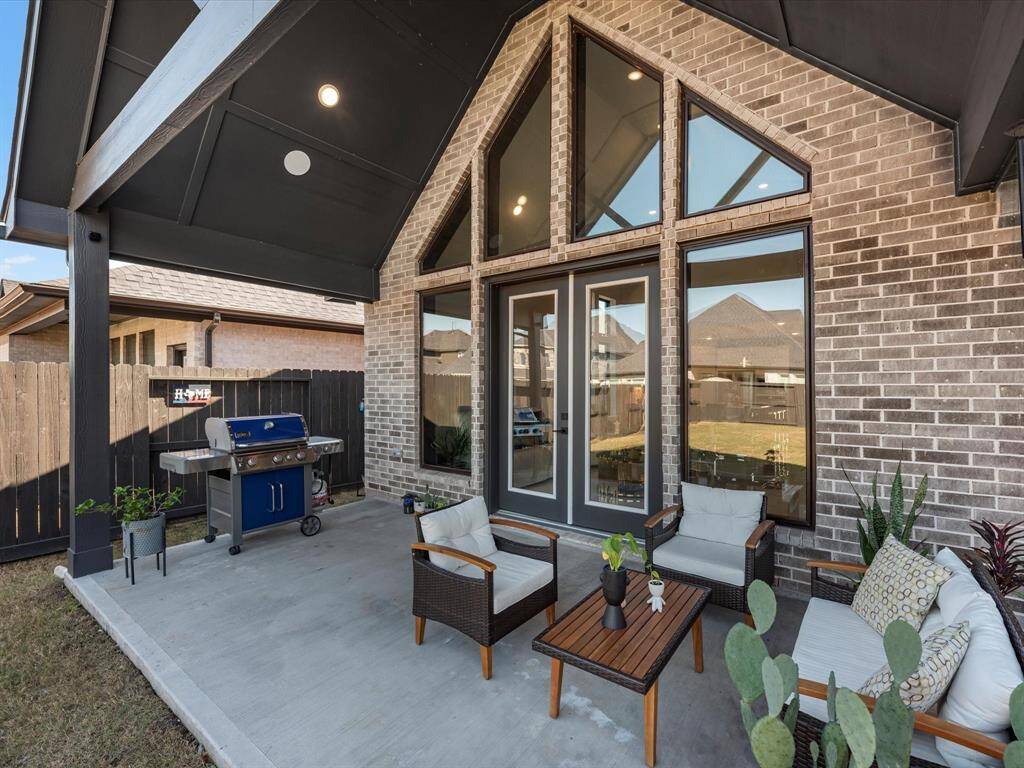 enjoy cozy nights with friends in this beautiful extended patio with a huge yard  with sprinklers system for easy care.