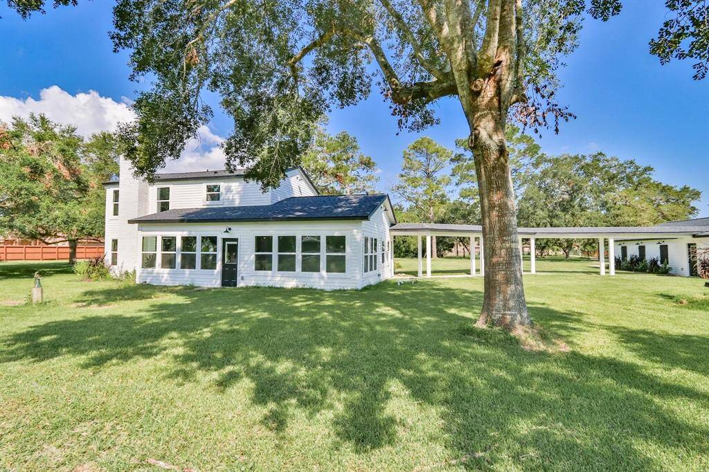 Character Filled Residence In The Heart Of Santa Fe. Custom rebuilt home on expansive 1.48 acres of lush lawn, mature soaring trees and wide-open spaces!