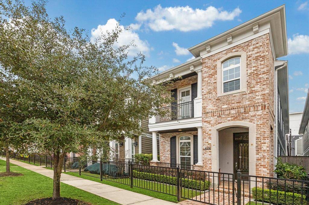 Nestled in the sought-after Houston Heights, this meticulously crafted home showcases a striking blend of traditional architecture and modern refinement. A charming brick façade, accented with arched entryways and timeless details, sets the tone for the sophisticated design within.