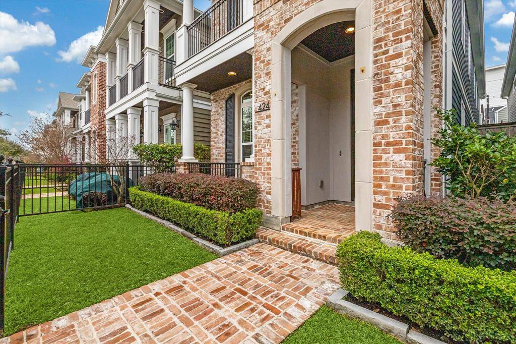 A wrought iron fence frames the lushly landscaped front yard, leading to a welcoming covered entry. The second-story balcony, complete with classic columns and black iron railing, offers the perfect vantage point for enjoying the Heights’ walkable streetscape. Located in one of Houston’s most vibrant communities, this residence provides easy access to local parks, boutiques, and acclaimed dining destinations.
