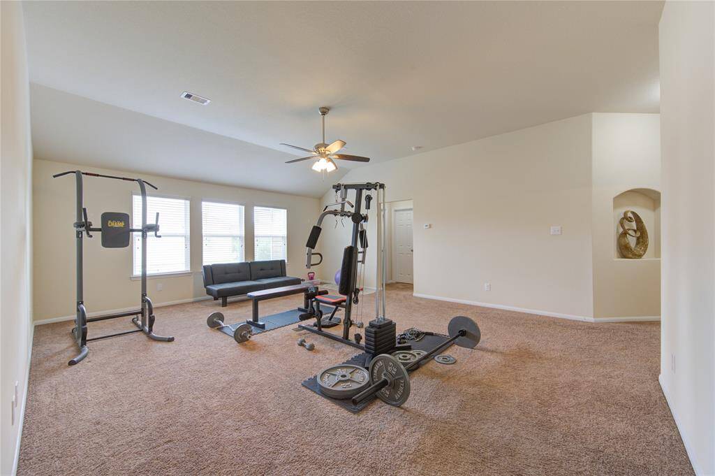 The flex space sits in the middle of four bedrooms and two bathrooms.