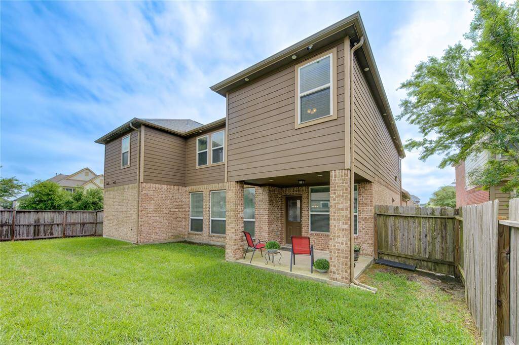 Large backyard with covered patio